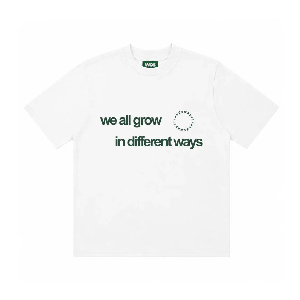 WE ALL GROW IN DIFFERENT WAYS TEE