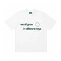 WE ALL GROW IN DIFFERENT WAYS TEE