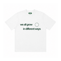 WE ALL GROW IN DIFFERENT WAYS TEE