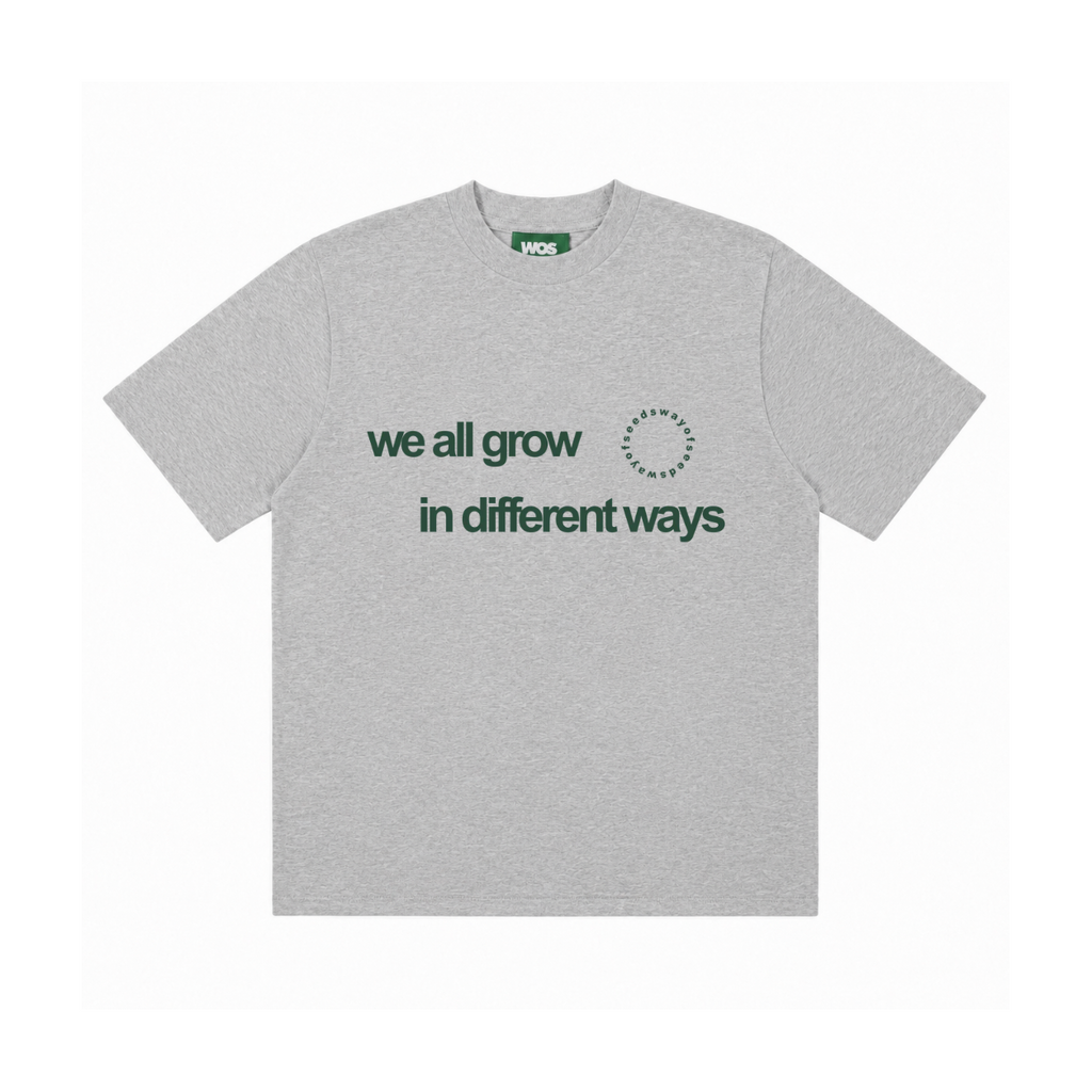 WE ALL GROW IN DIFFERENT WAYS TEE